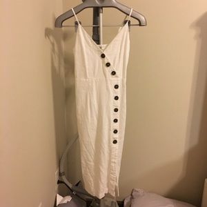 White mid-length dress with button detail